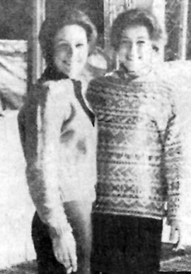 Throwback inspiration image of Meg Swansen wearing a cream cardigan and her sister Lloie in an allover color sweater, smoking, ski bums, black and white