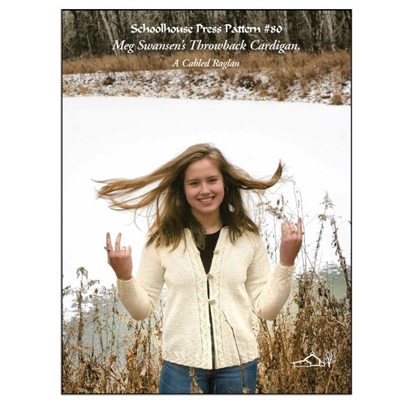 image of young woman in cream wool cardigan with cables at side, butterfly buttons, pond with snow in background