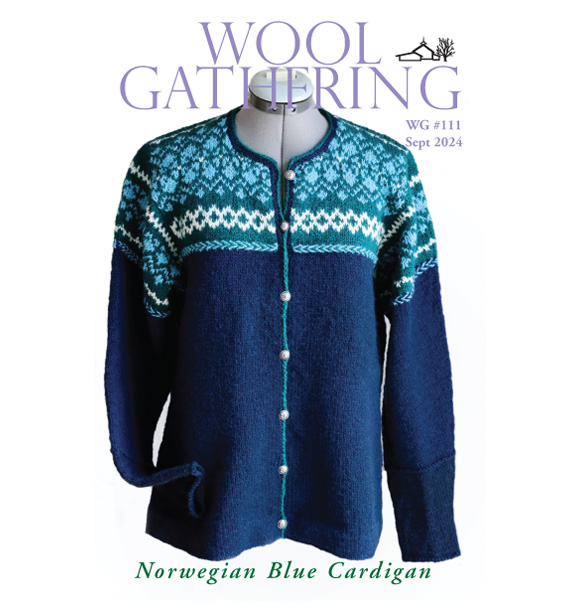 Wool Gathering Issue 111 cover, Norwegian Blue Cardigan shown in blues, green, and washed white yoke motifs with navy body